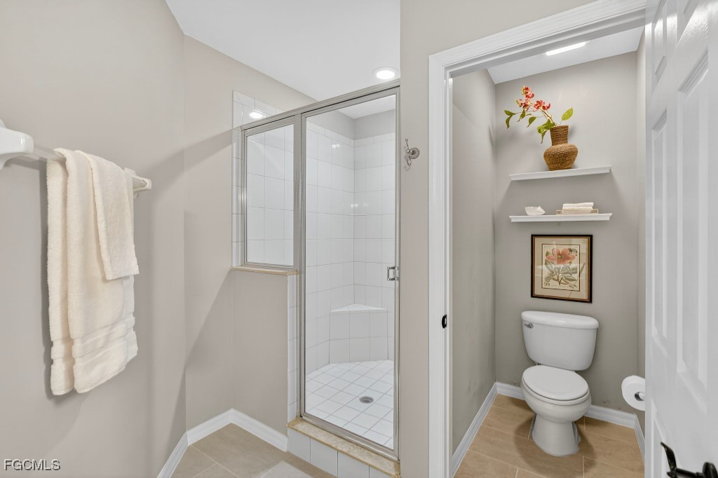 3610 Lansing Loop, Unit 102 Estero, FL 33928 - Photo 16 of 27 a bathroom with a toilet sink and shower