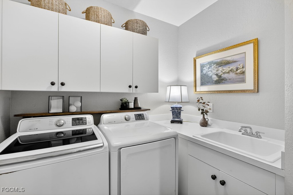 3610 Lansing Loop, Unit 102 Estero, FL 33928 - Photo 22 of 27 a view of storage and utility room with washer and dryer
