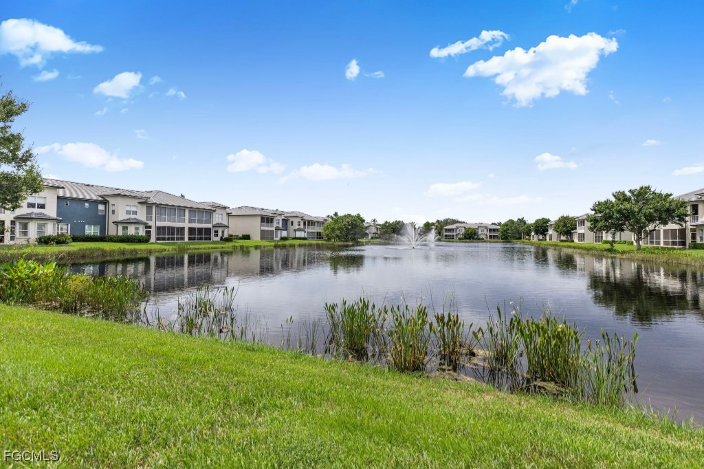 3610 Lansing Loop, Unit 102 Estero, FL 33928 - Photo 25 of 27 a view of a lake with a city