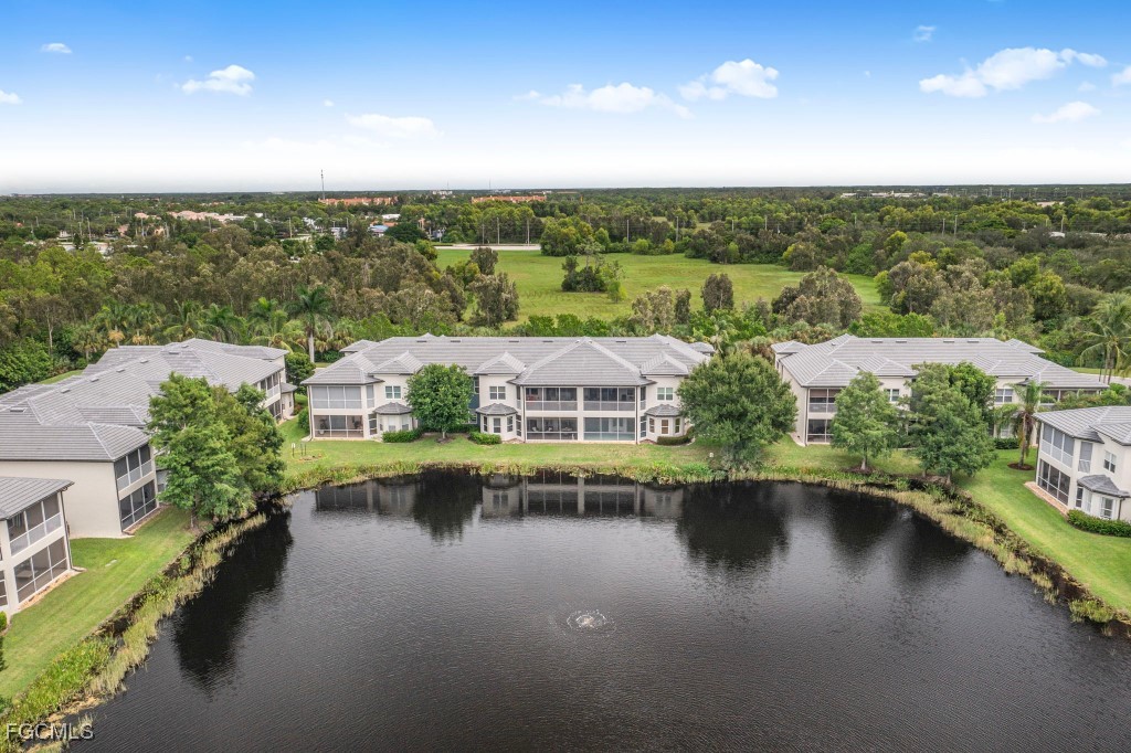 3610 Lansing Loop, Unit 102 Estero, FL 33928 - Photo 26 of 27 a view of a lake with a city