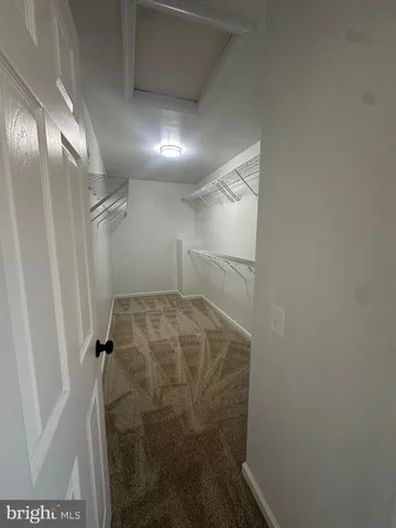 a bathroom with a glass door shower