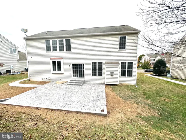 a view of a yard in front of a house with a yard
