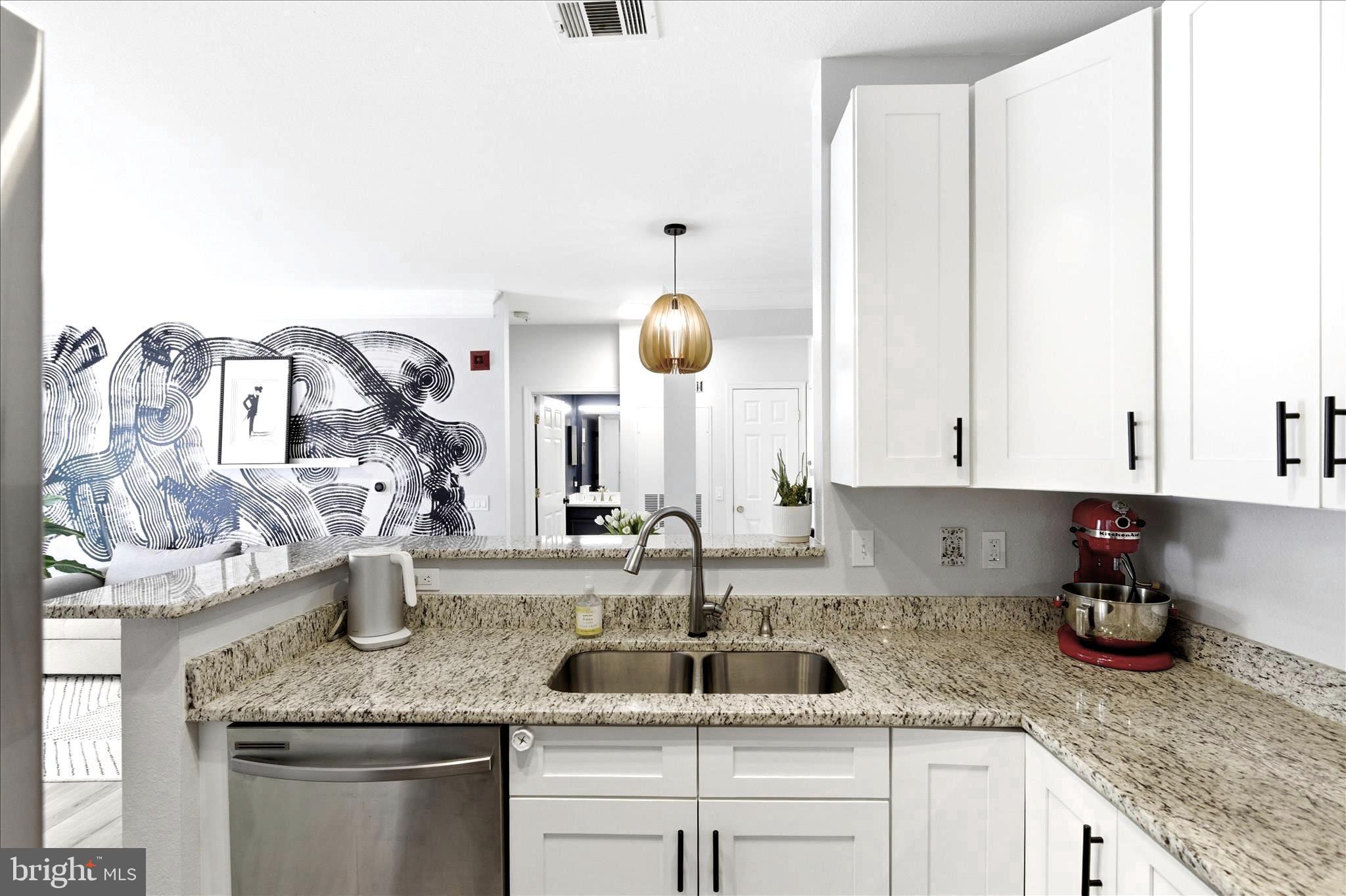 1601 Spring Gate Dr., Unit 1204 McLean, VA 22102 - Photo 11 of 52 a kitchen with a sink and cabinets