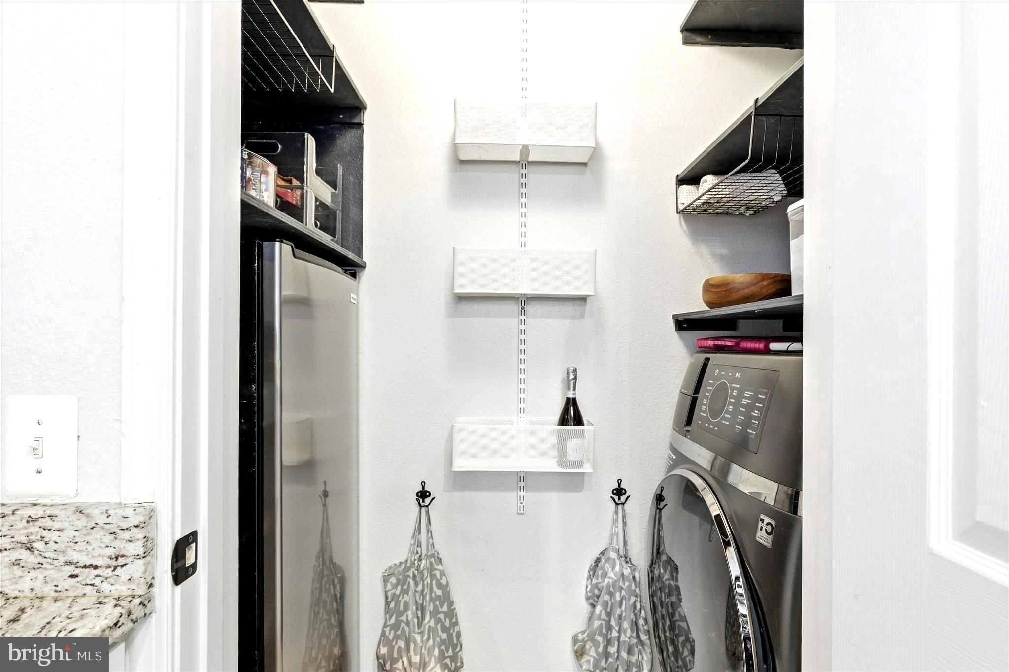 1601 Spring Gate Dr., Unit 1204 McLean, VA 22102 - Photo 13 of 52 a view of walk in closet with clothes and shoes