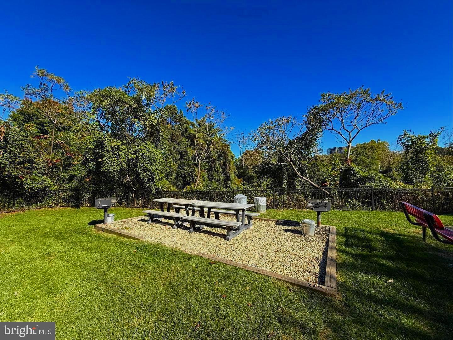 1601 Spring Gate Dr., Unit 1204 McLean, VA 22102 - Photo 31 of 52 a garden with trees in the background