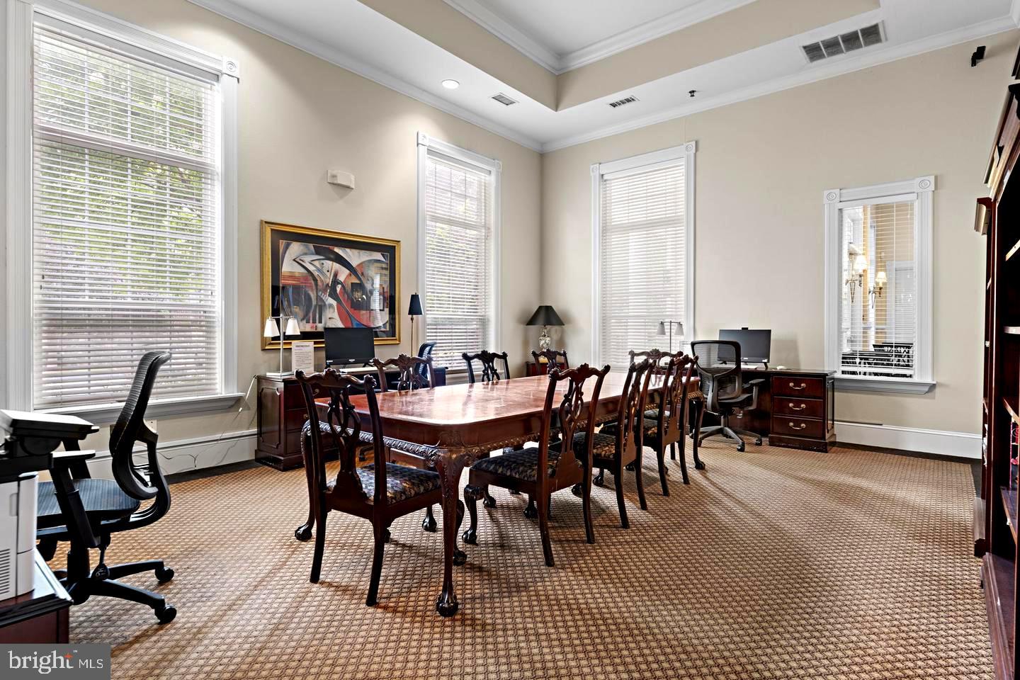 1601 Spring Gate Dr., Unit 1204 McLean, VA 22102 - Photo 38 of 52 a view of a a dining room with furniture window and wooden floor