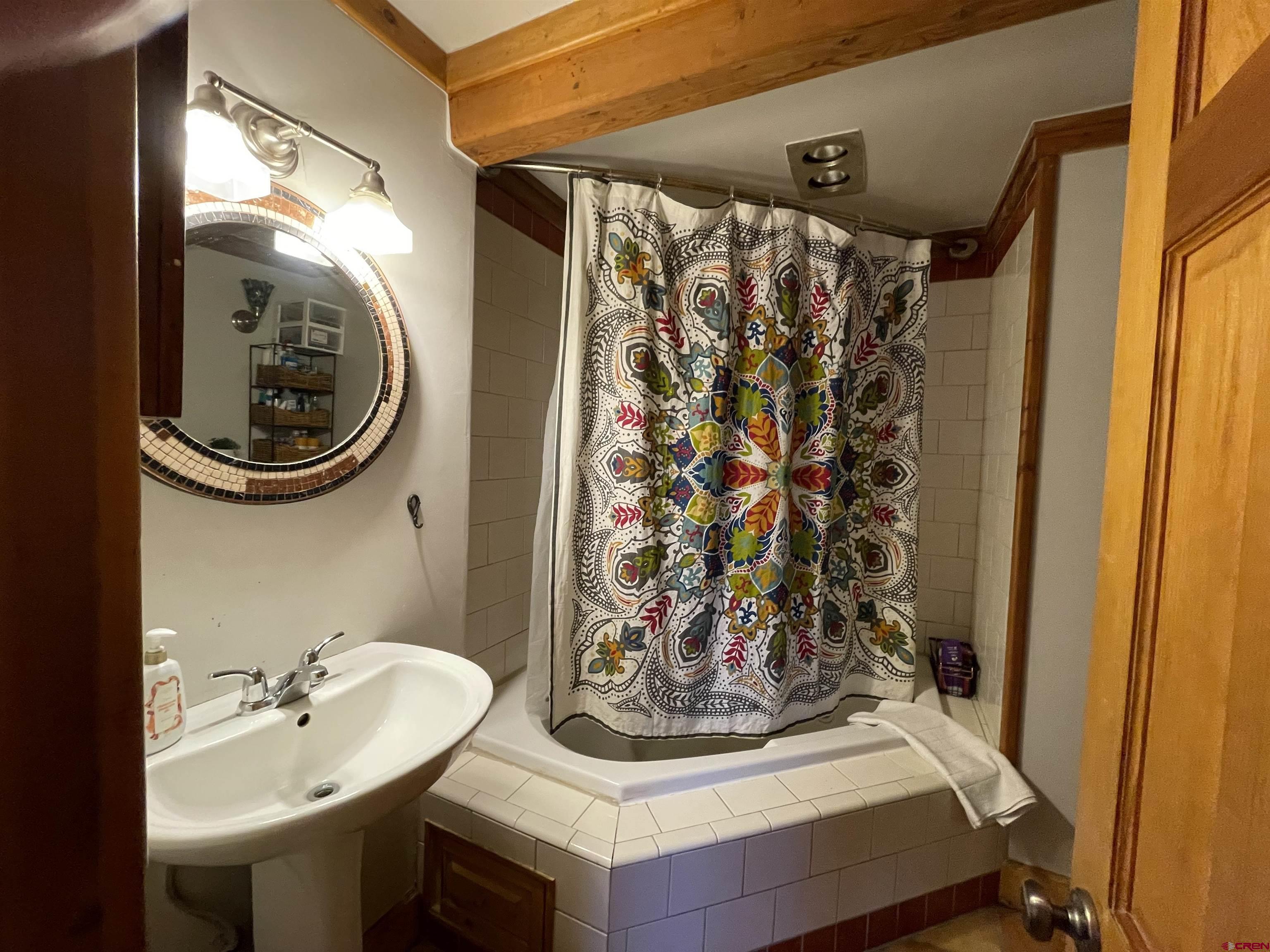 28 Whiterock Avenue, Unit 2 Crested Butte, CO 81224 - Photo 12 of 31 a bathroom with a sink and a mirror