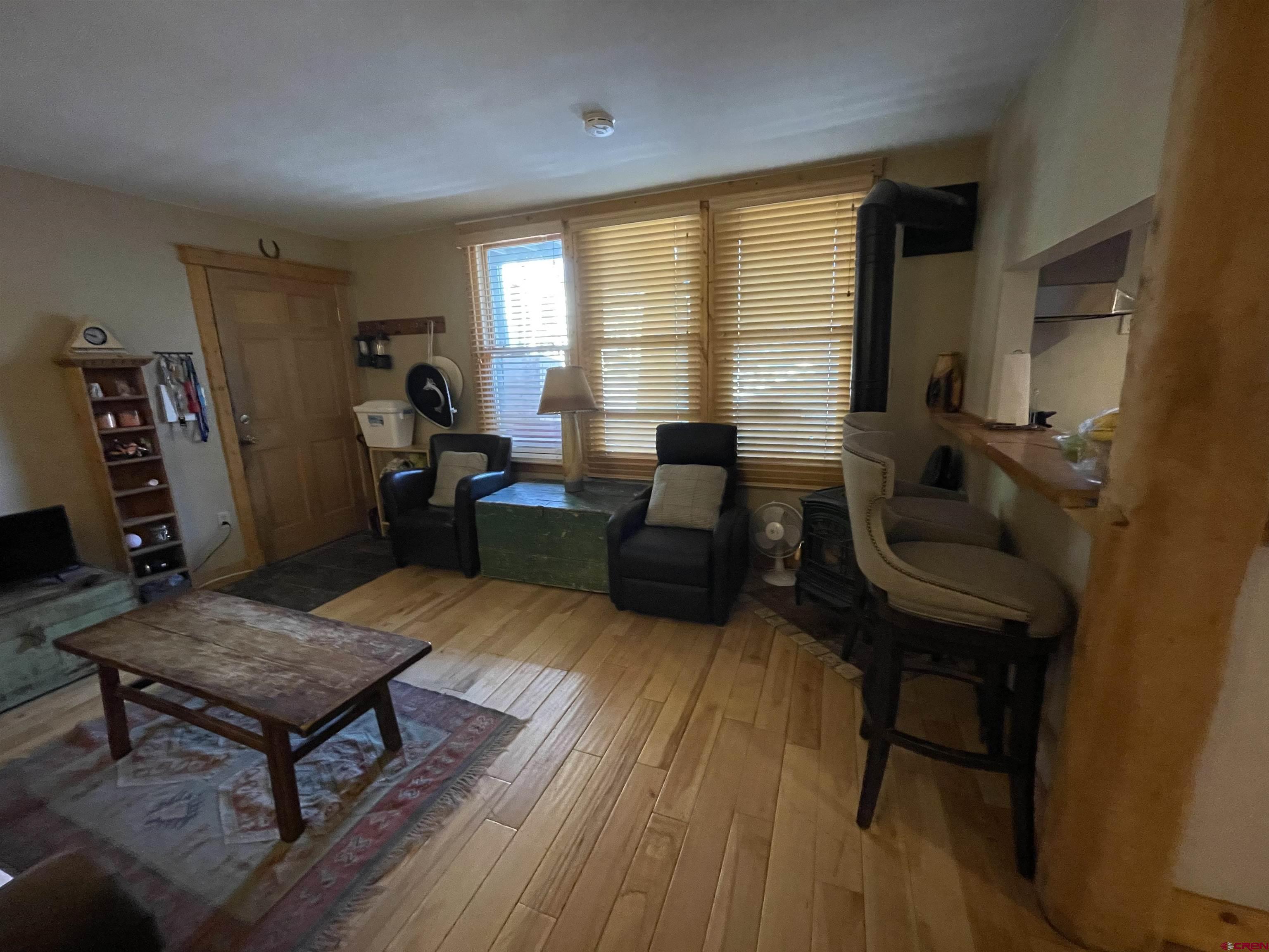 28 Whiterock Avenue, Unit 2 Crested Butte, CO 81224 - Photo 2 of 31 a living room with furniture and a wooden floor