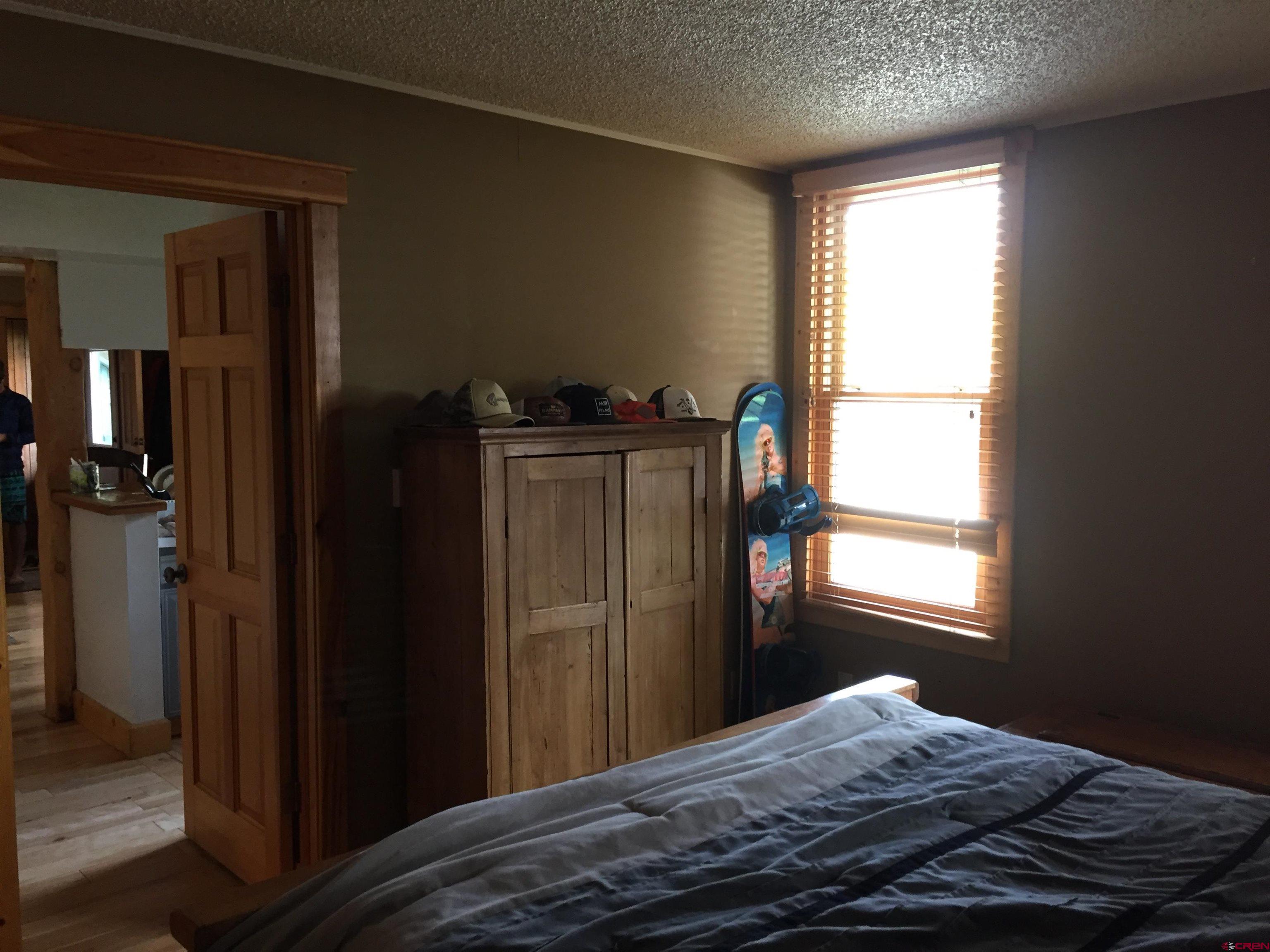 28 Whiterock Avenue, Unit 2 Crested Butte, CO 81224 - Photo 30 of 31 a bedroom with a bed and a window