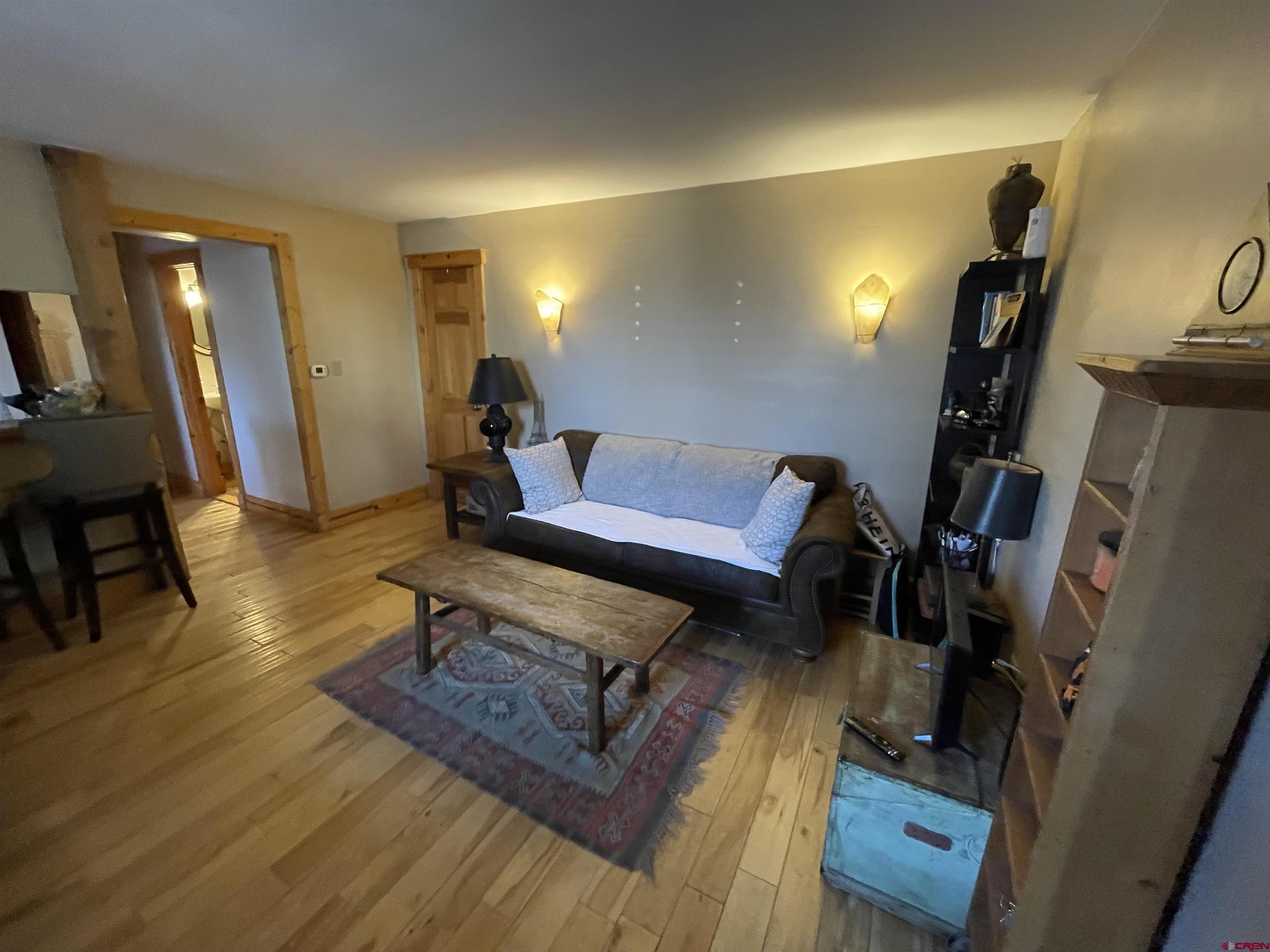 28 Whiterock Avenue, Unit 2 Crested Butte, CO 81224 - Photo 4 of 31 a living room with furniture and wooden floor