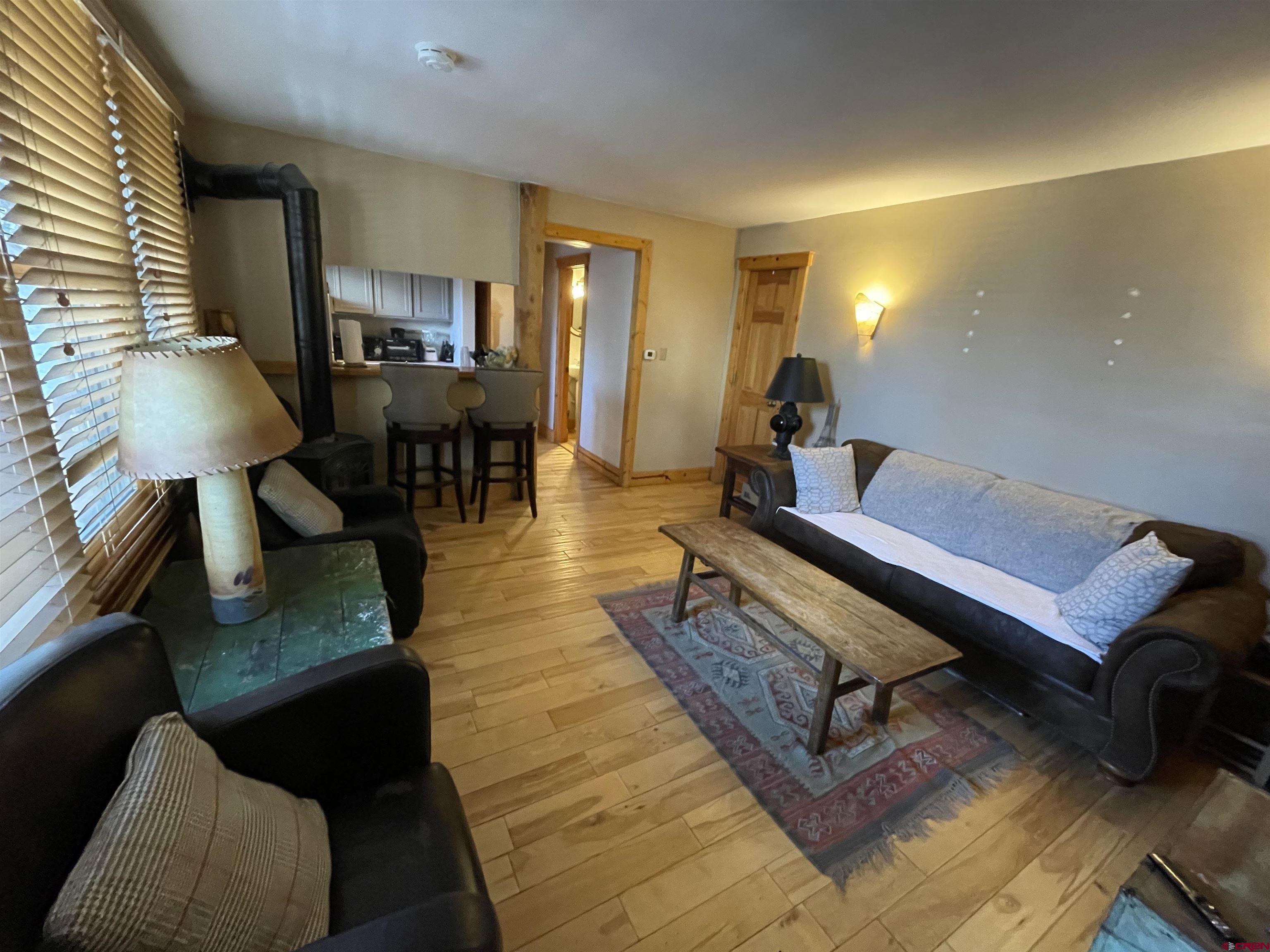 28 Whiterock Avenue, Unit 2 Crested Butte, CO 81224 - Photo 5 of 31 a living room with furniture and wooden floor