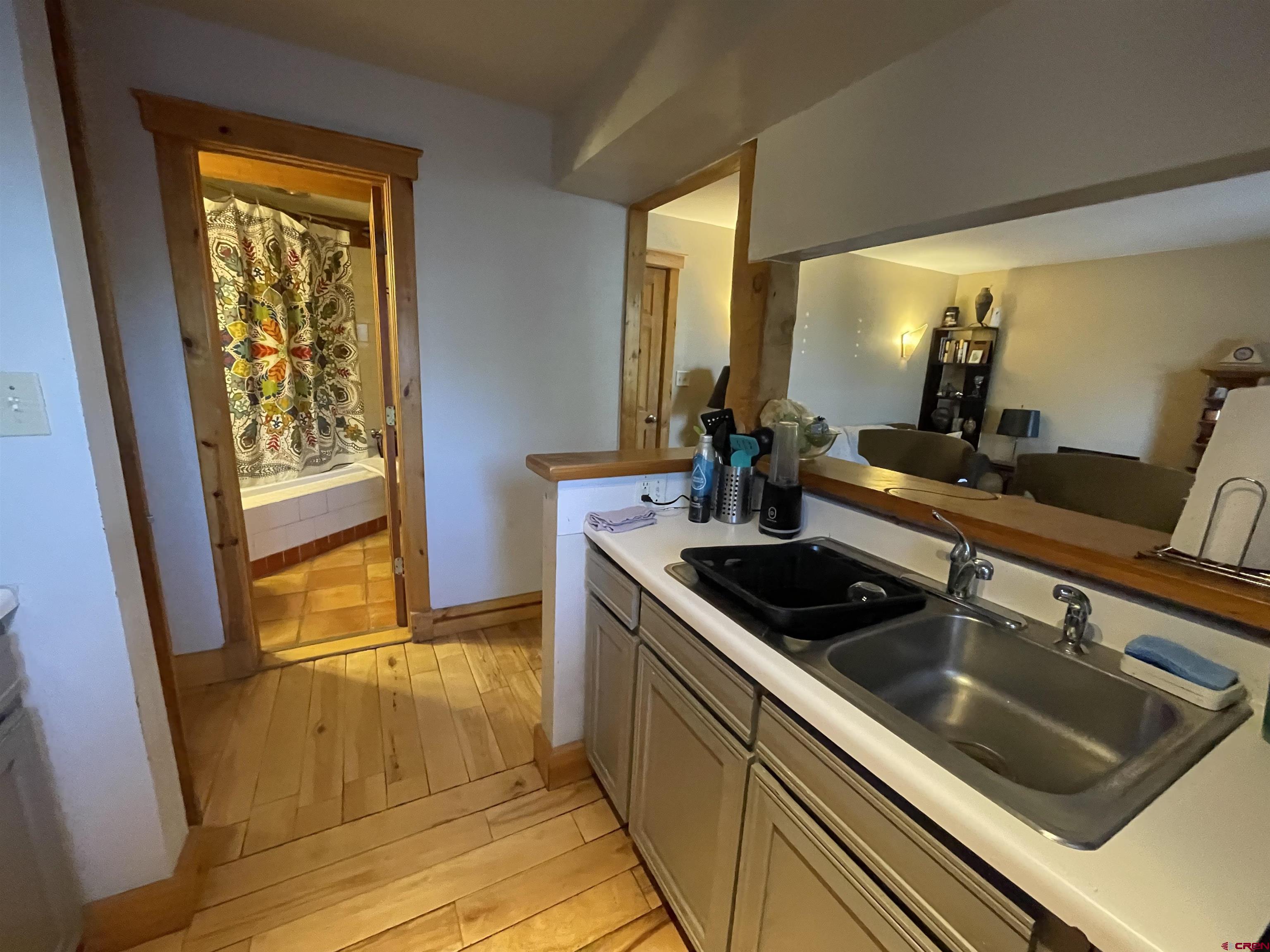 28 Whiterock Avenue, Unit 2 Crested Butte, CO 81224 - Photo 9 of 31 a kitchen with a sink stove and cabinets