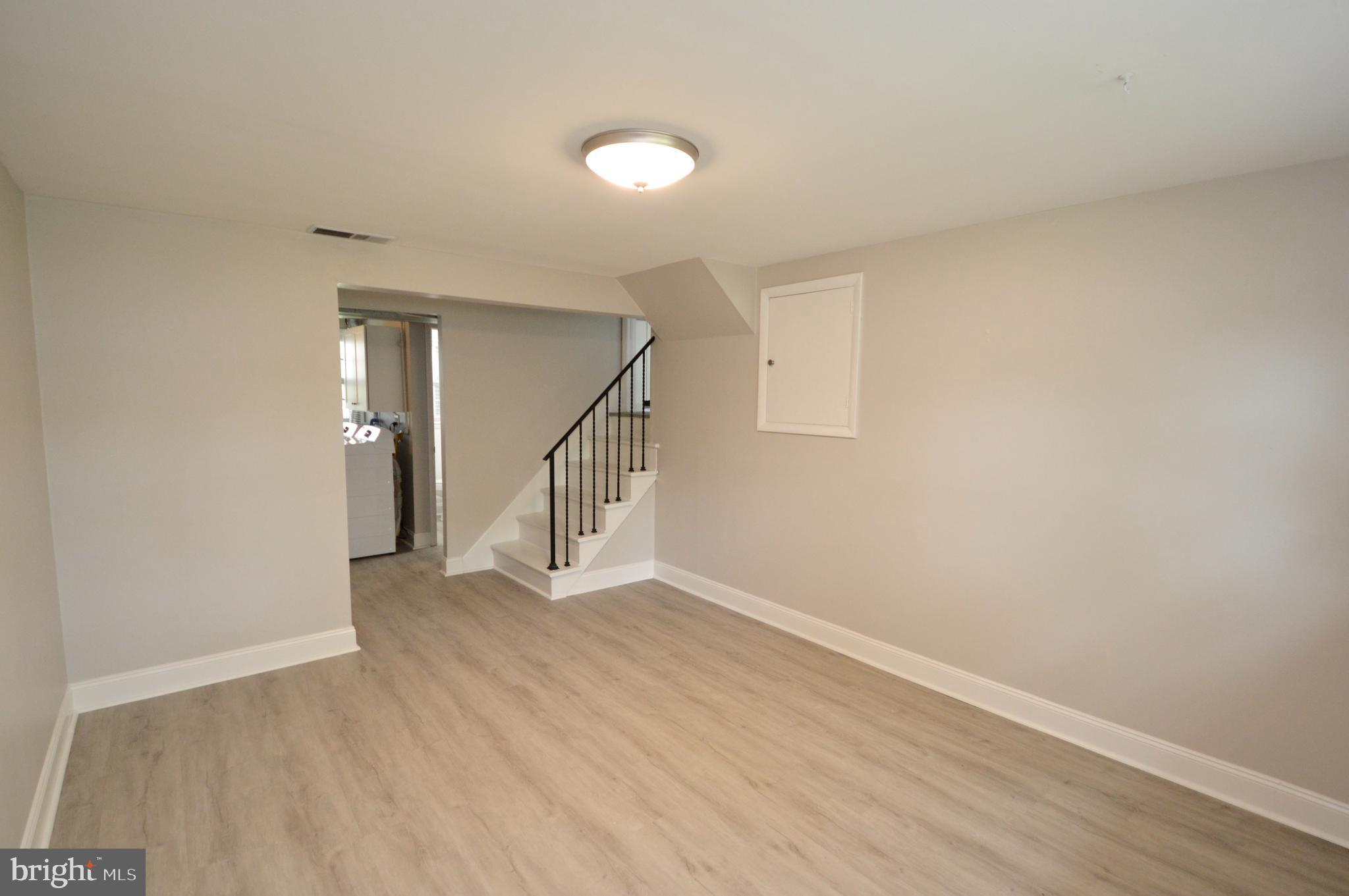 119 Ashbrook Road Cherry Hill, NJ 08034 - Photo 11 of 16 a view of an empty room with wooden floor and a window