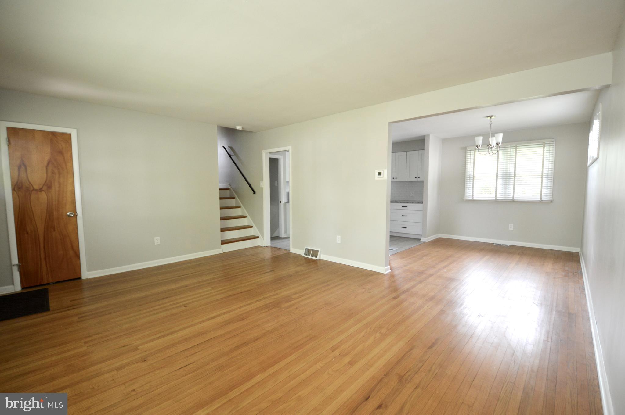 119 Ashbrook Road Cherry Hill, NJ 08034 - Photo 2 of 16 an empty room with wooden floor and windows