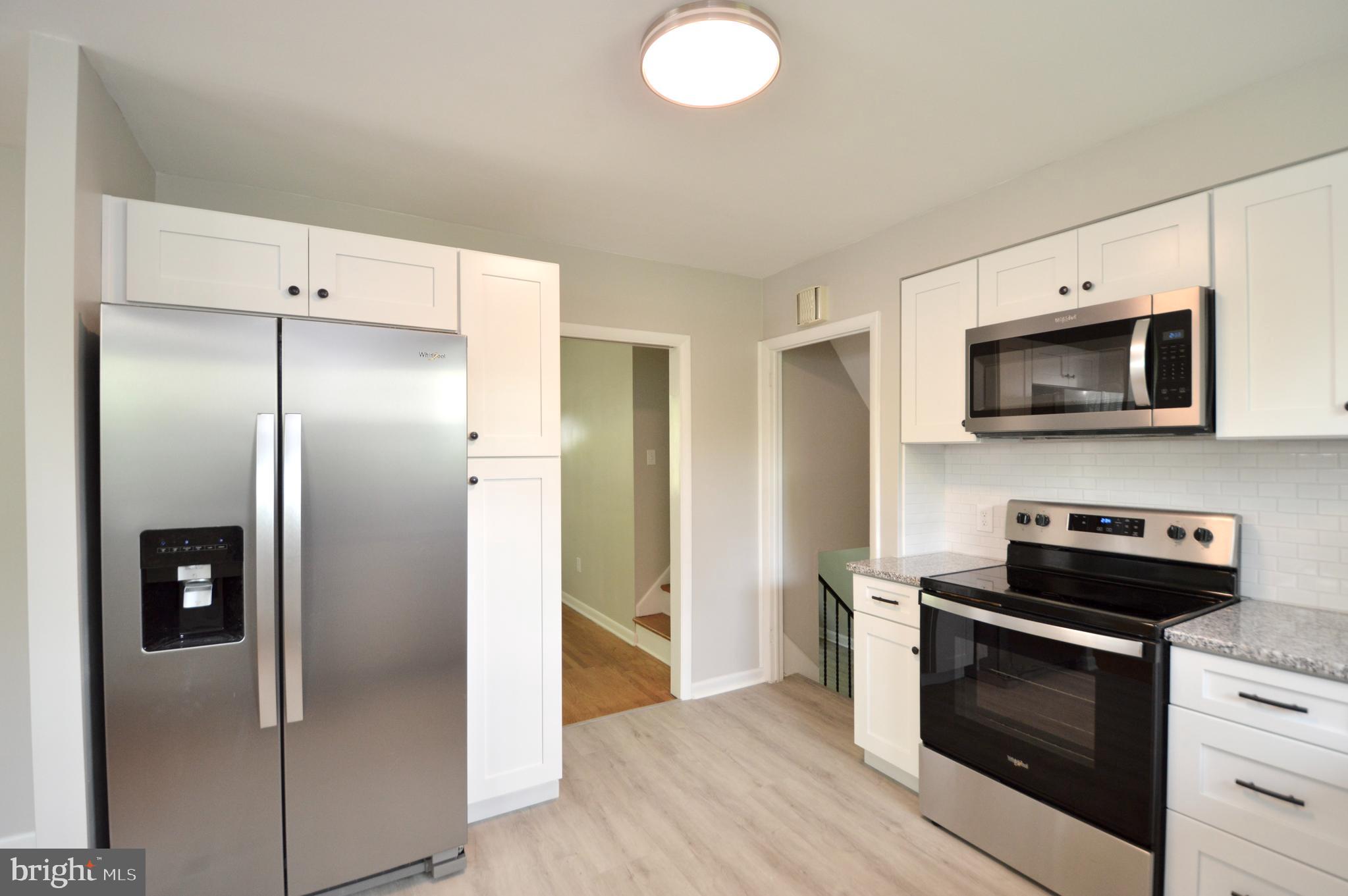 119 Ashbrook Road Cherry Hill, NJ 08034 - Photo 6 of 16 a kitchen with stainless steel appliances granite countertop a refrigerator and a stove top oven
