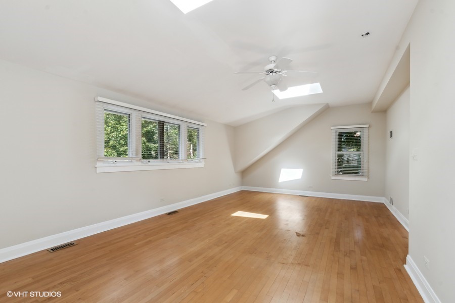 1282 Edgewood Road Lake Forest, IL 60045 - Photo 16 of 27 wooden floor in an empty room with a window