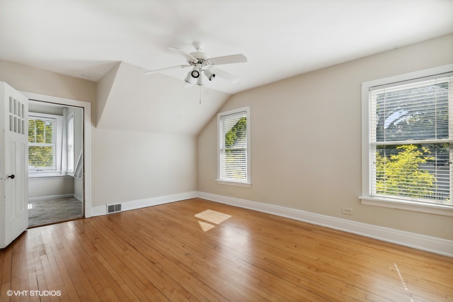 1282 Edgewood Road Lake Forest, IL 60045 - Photo 20 of 27 a view of an empty room with a window and wooden floor