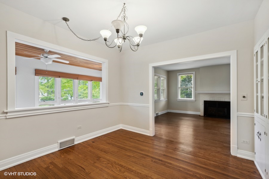 1282 Edgewood Road Lake Forest, IL 60045 - Photo 7 of 27 a view of an empty room with wooden floor and a window