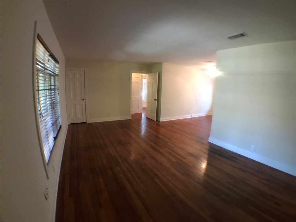 2509 Enfield Road, Unit C Austin, TX 78703 - Photo 13 of 14 Unfurnished room with baseboards and dark wood-style flooring