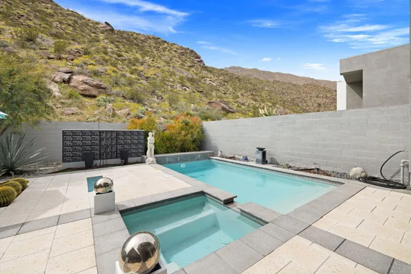 a view of walk in closet with clothes