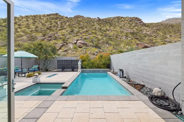 a view of a swimming pool with a patio