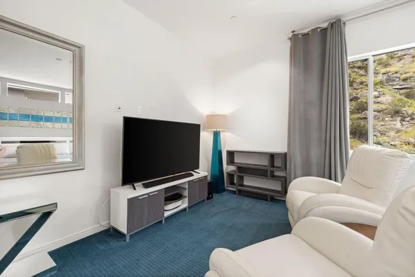a bathroom with a shower sink and mirror