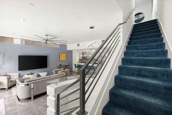a kitchen with a sink appliances and cabinets