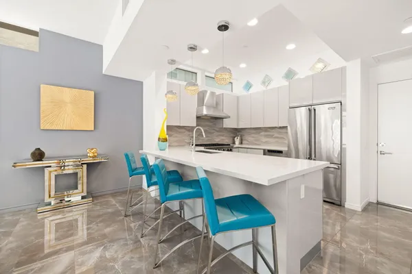 a kitchen with a stove and a sink