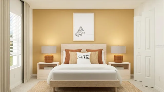 a bedroom with a bed a dresser and a window