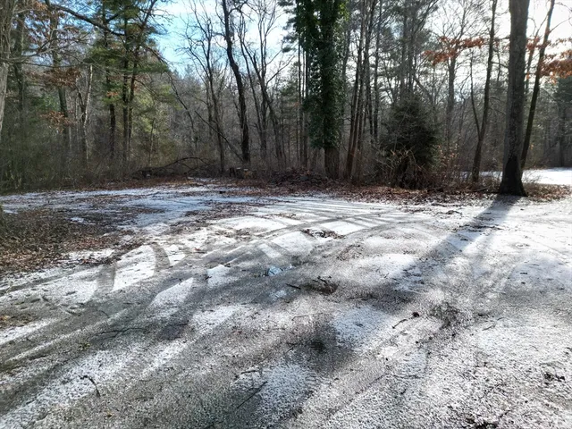 a view of wooden fence of a house
