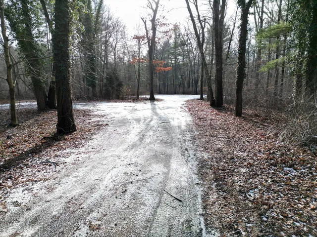 a view of a backyard of the house