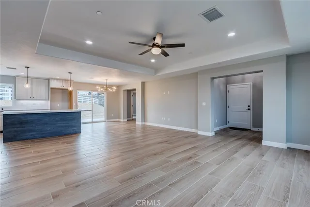 a large kitchen with kitchen island a large island in it