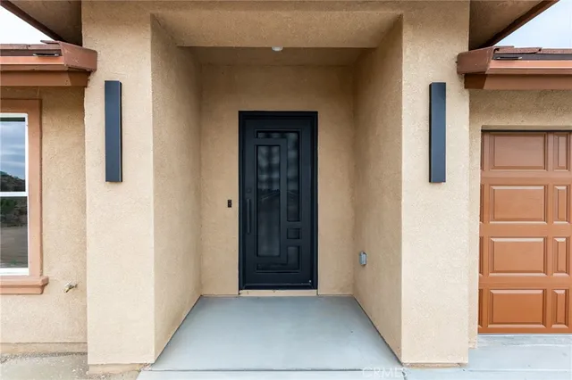 a view of living room with furniture and wooden floor