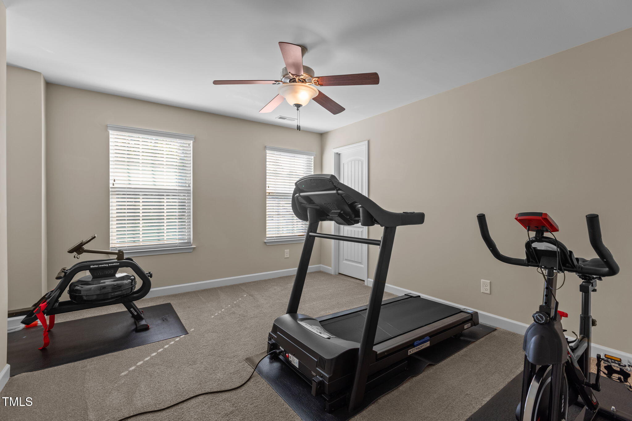 3412 South Beaver Lane Raleigh, NC 27604 - Photo 16 of 30 a room with gym equipment and windows