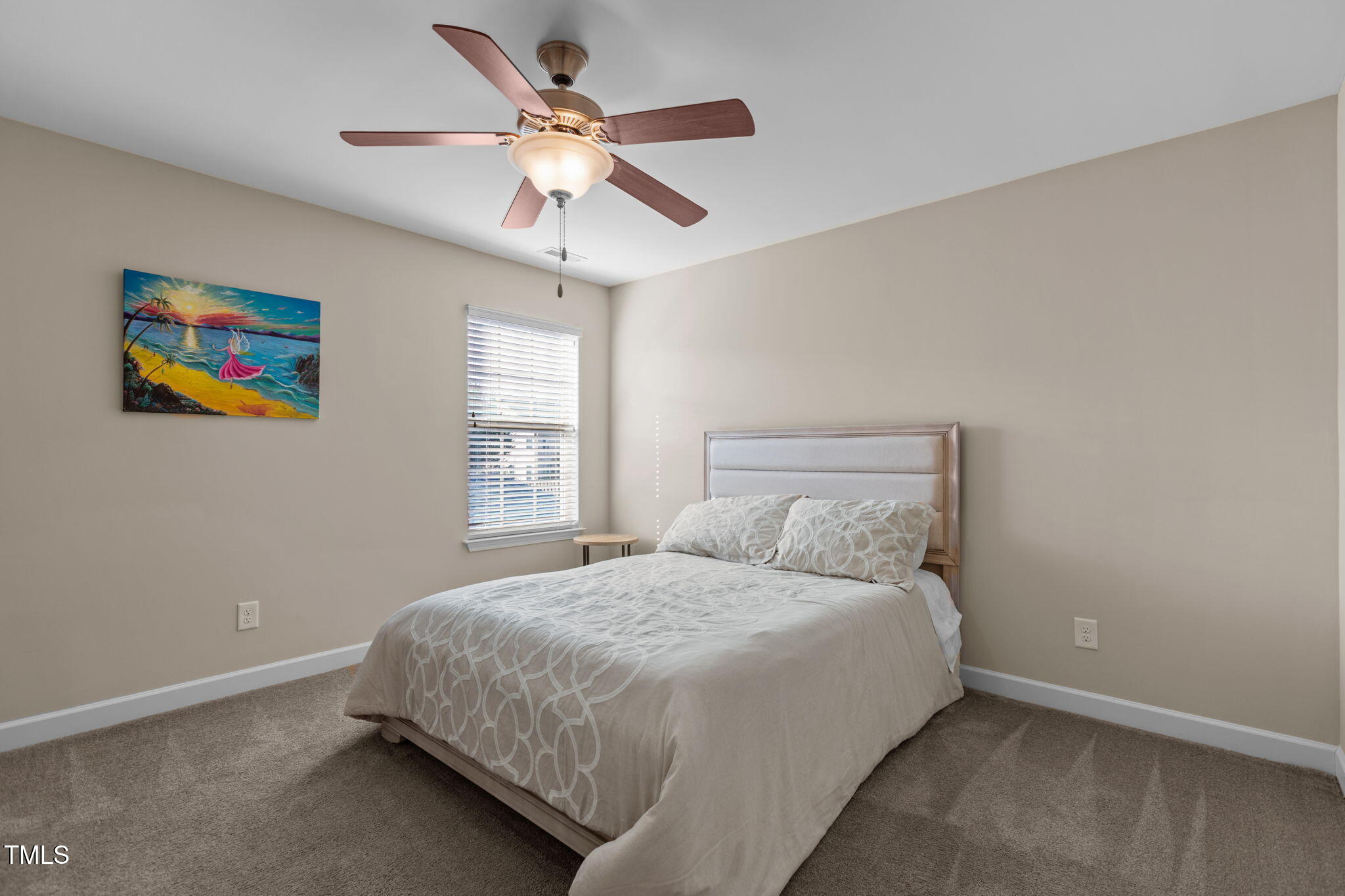 3412 South Beaver Lane Raleigh, NC 27604 - Photo 18 of 30 a bedroom with a bed and a chandelier