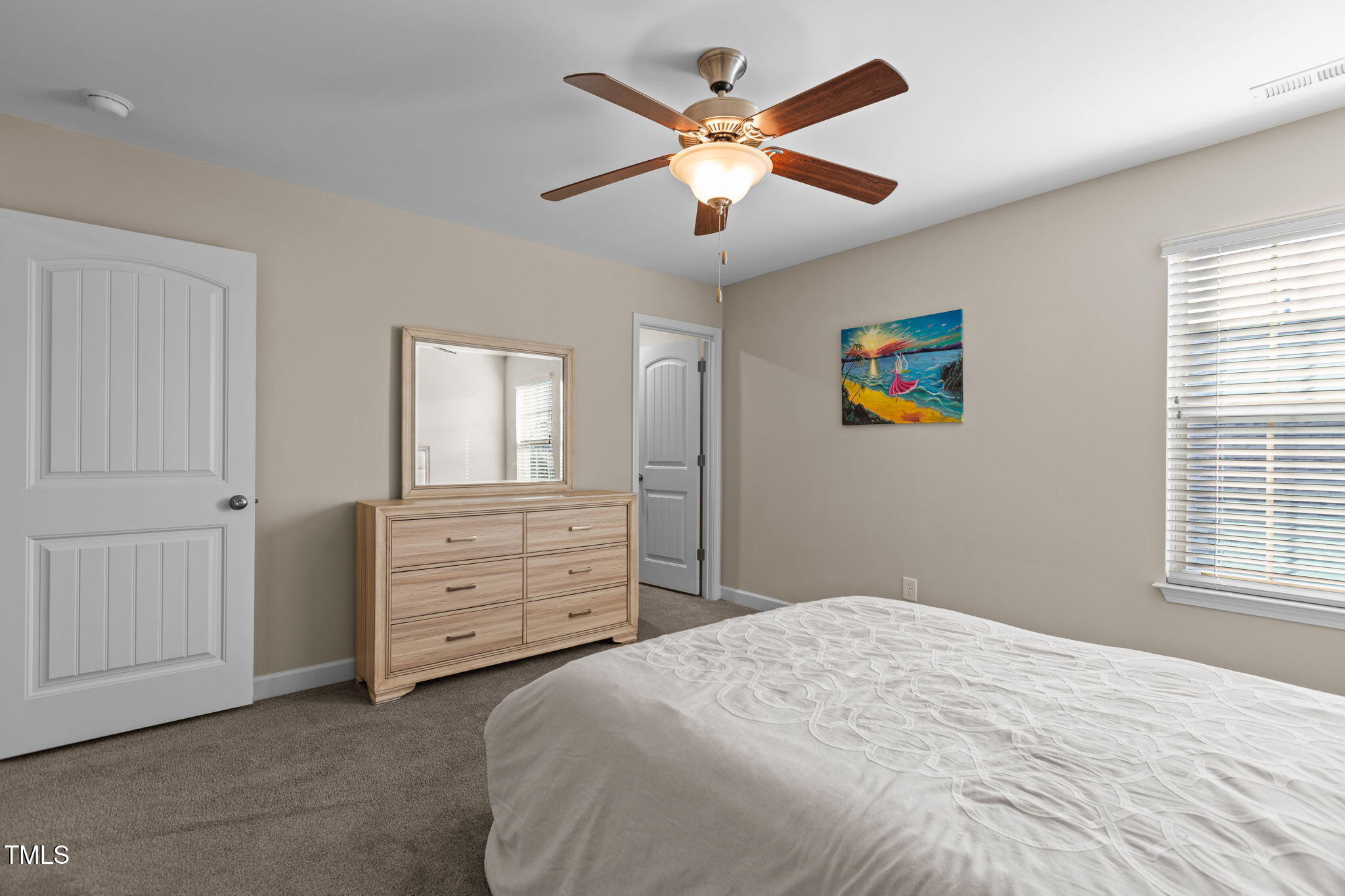 3412 South Beaver Lane Raleigh, NC 27604 - Photo 19 of 30 a bedroom with a bed dresser and a window