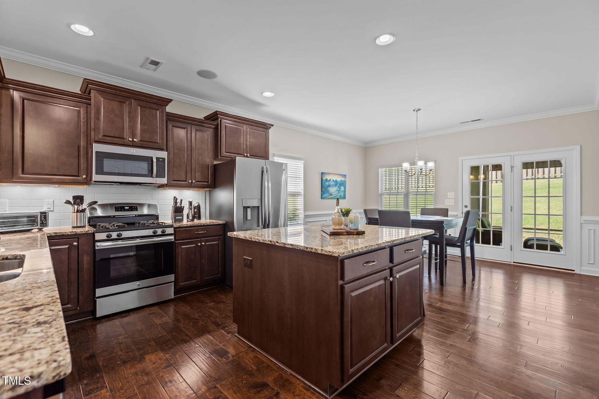 3412 South Beaver Lane Raleigh, NC 27604 - Photo 2 of 30 a kitchen with a stove sink and refrigerator