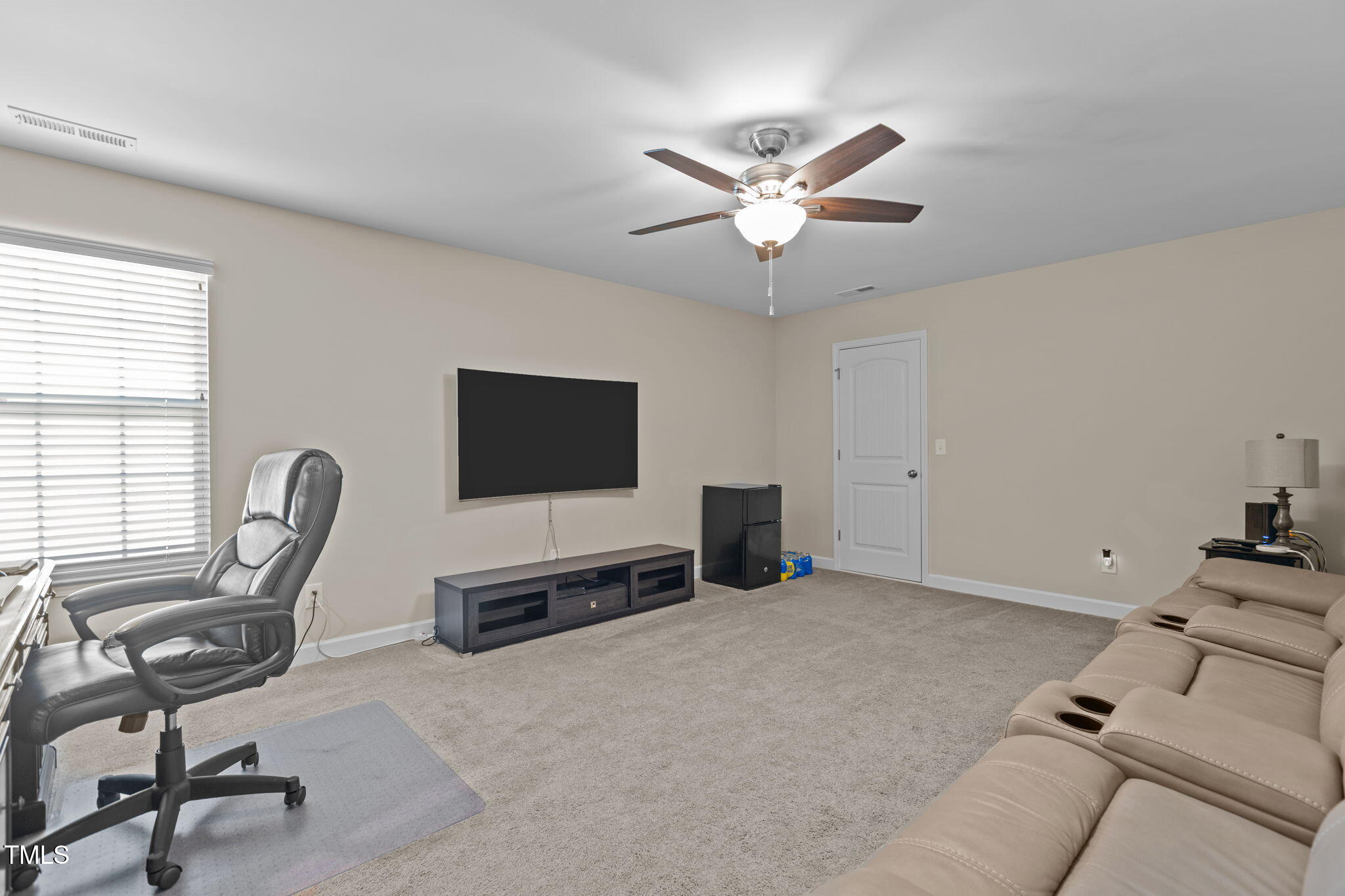 3412 South Beaver Lane Raleigh, NC 27604 - Photo 21 of 30 a view of a livingroom with workspace and a window