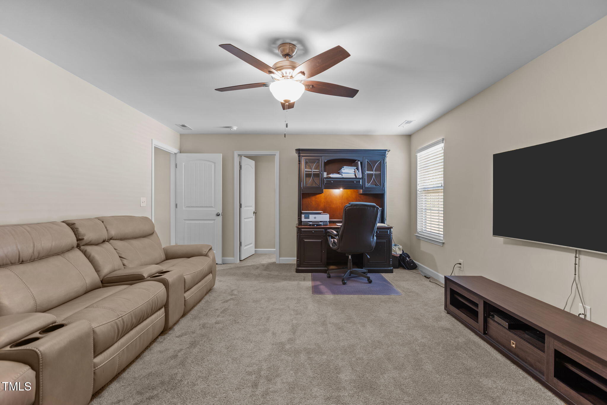 3412 South Beaver Lane Raleigh, NC 27604 - Photo 22 of 30 a living room with furniture and a flat screen tv