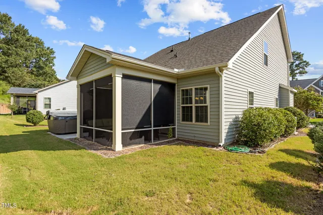 a view of a backyard with table and chairs