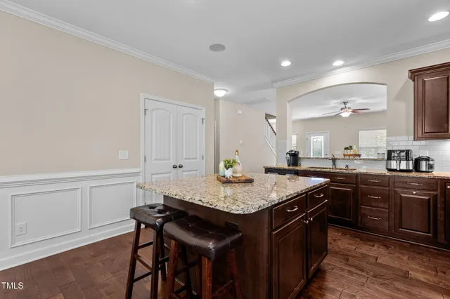 a kitchen with a stove a sink and a refrigerator