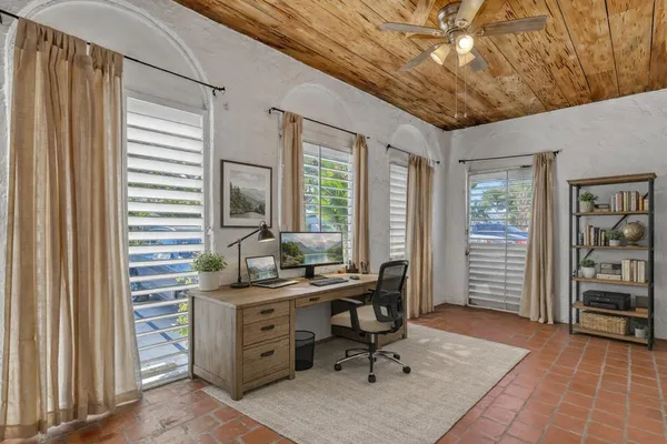 a workspace with furniture and window