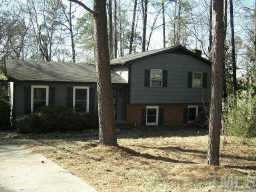 4313 Woodlawn Drive Raleigh, NC 27616 - Photo 1 of 1 a house with trees in the background