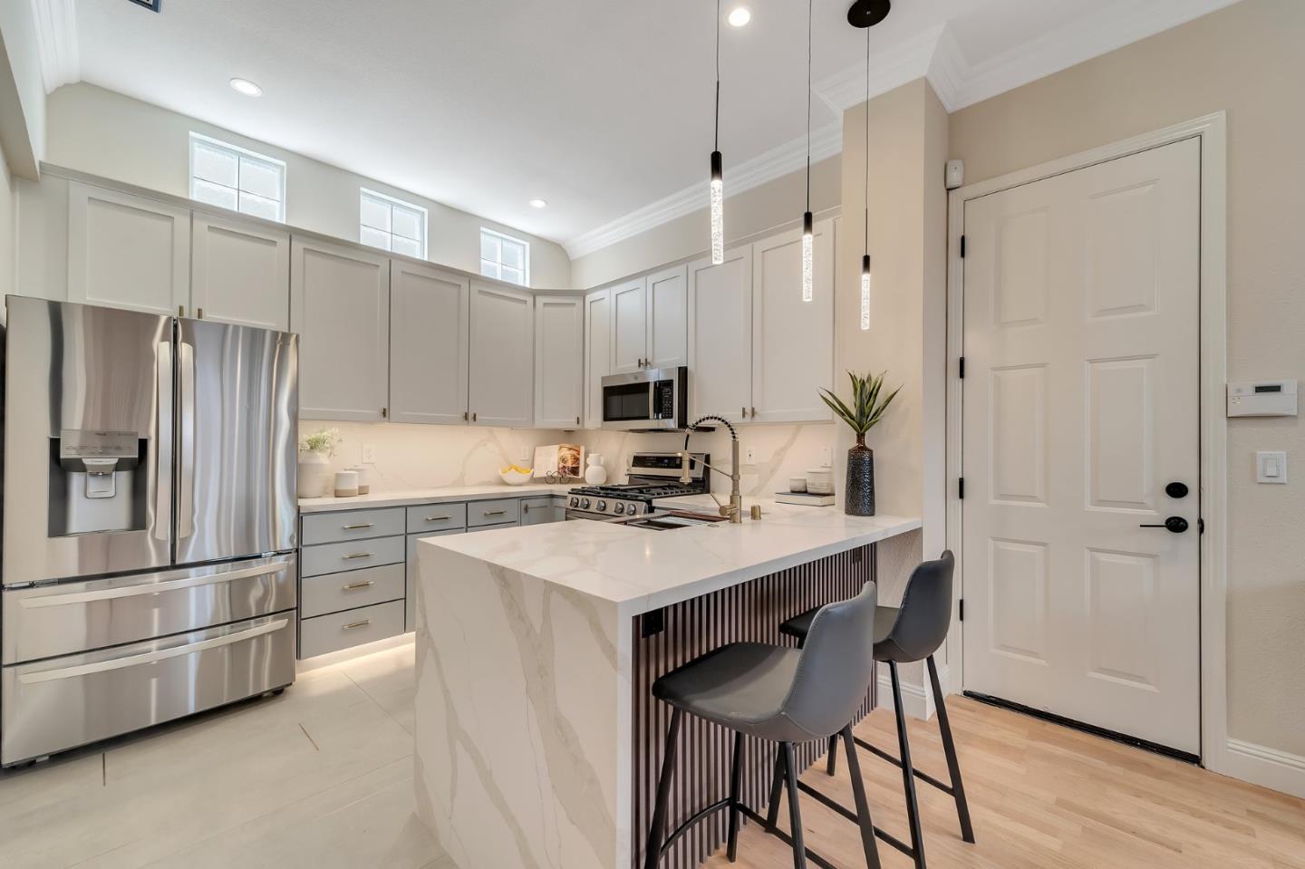 545 Minton Lane Mountain View, CA 94041 - Photo 11 of 31 a kitchen with a refrigerator a sink and chairs