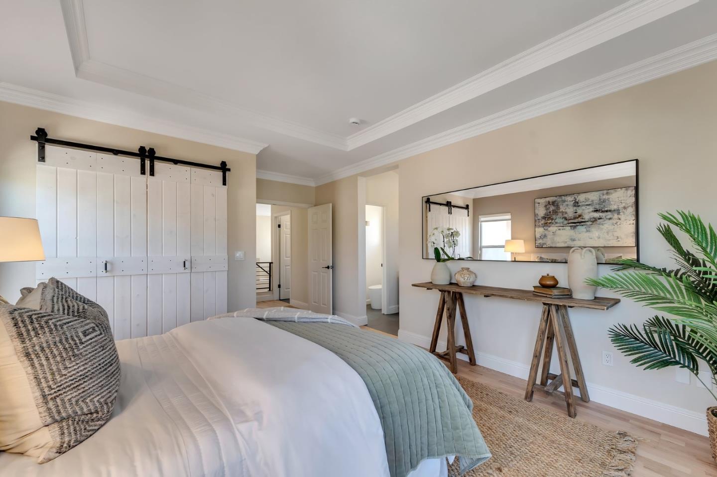 545 Minton Lane Mountain View, CA 94041 - Photo 15 of 31 a bedroom with a bed a table and painting on the wall