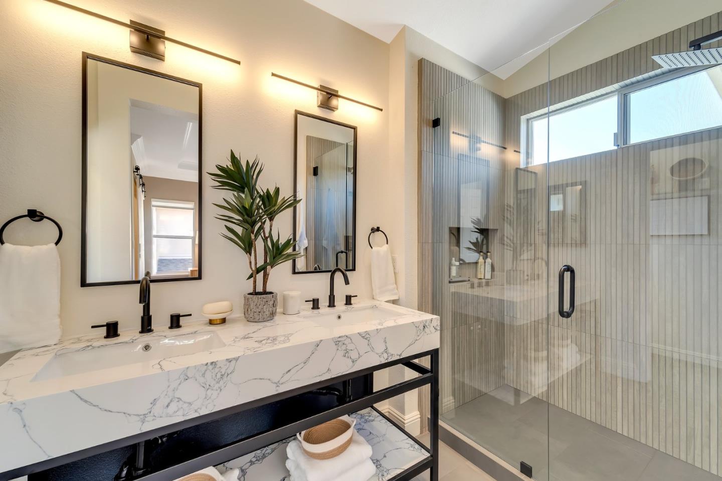 545 Minton Lane Mountain View, CA 94041 - Photo 17 of 31 a bathroom with a granite countertop sink a mirror and shower