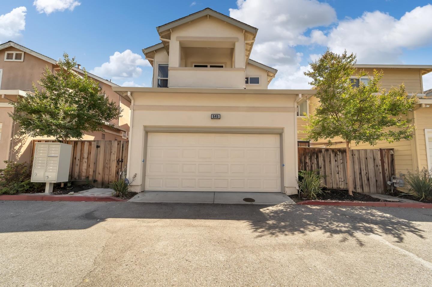 545 Minton Lane Mountain View, CA 94041 - Photo 27 of 31 a front view of a house with a yard and garage
