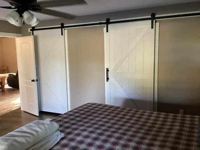 a bedroom with a bed and a walk in closet