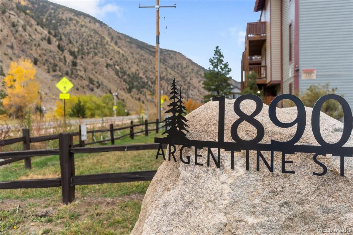 1890 Argentine Street, Unit 303 Georgetown, CO 80444 - Photo 13 of 22 a view of a chairs and table on the wooden deck
