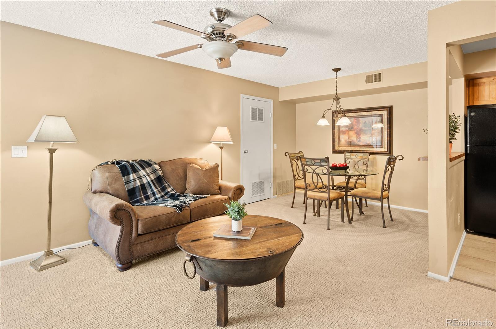 1890 Argentine Street, Unit 303 Georgetown, CO 80444 - Photo 2 of 22 a living room with furniture a chandelier and a dining table
